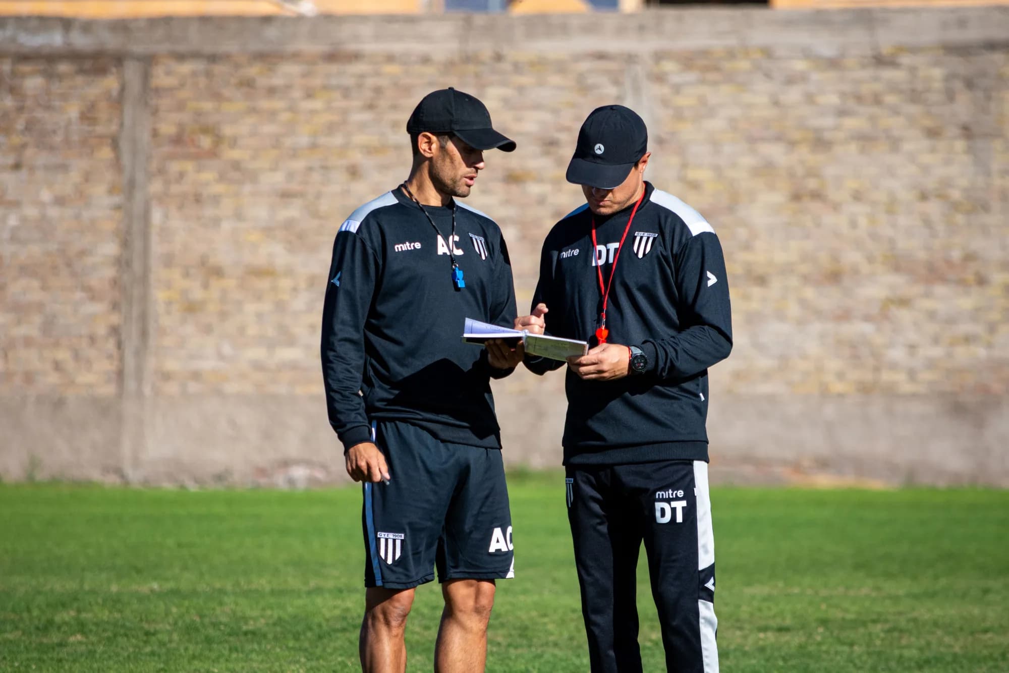 Coach reviewing tactics with the team